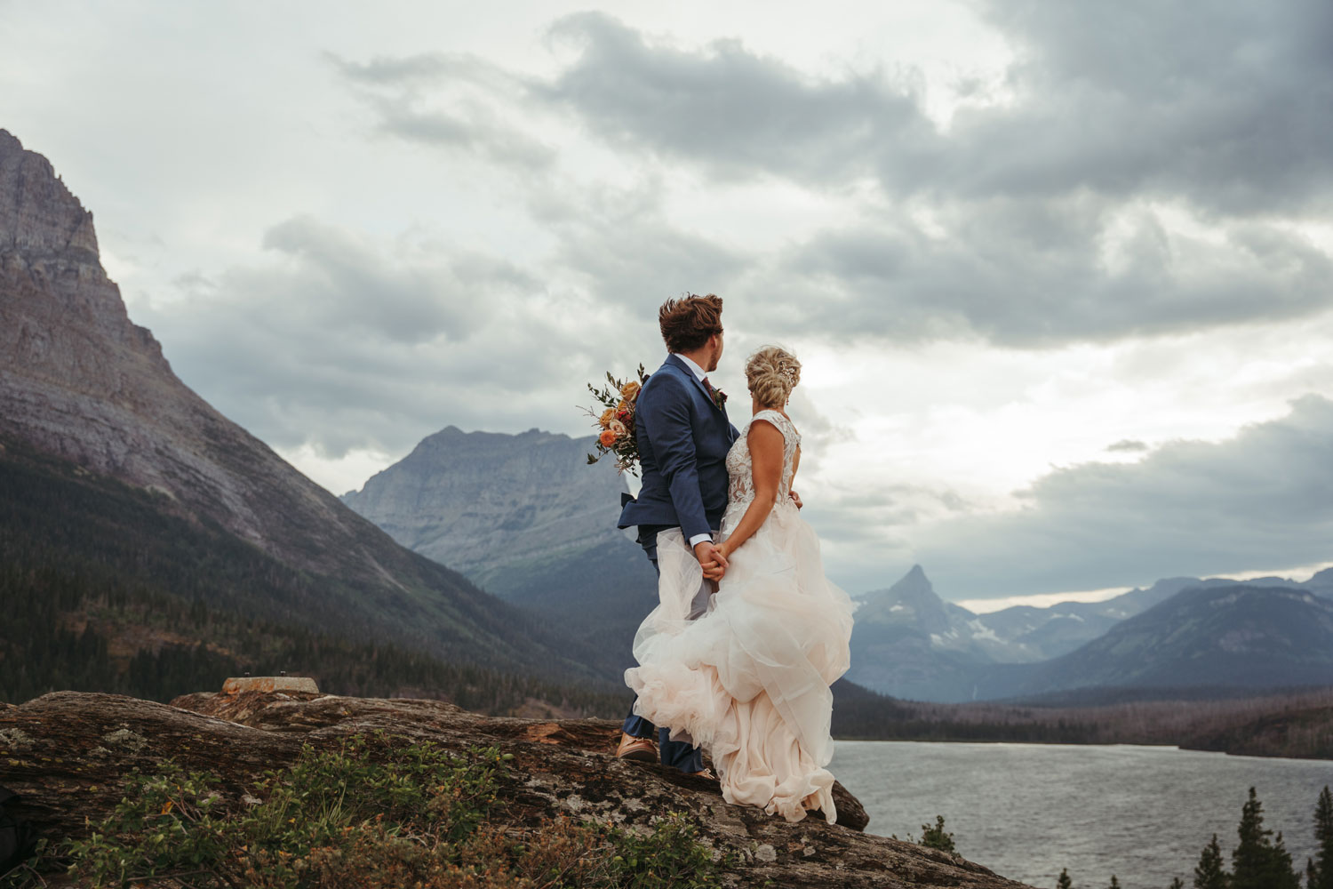 Abby and Beau on day one of their multi-day Glacier wedding adventure at Sun Point overlooking Saint Mary Lake.